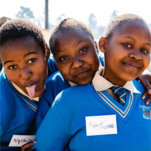 Three young women making fun faces at the camera