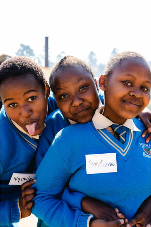 Three young women making fun faces at the camera